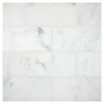 3" x 6" subway tile in honed White Blossom marble. 