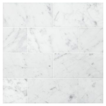 3" x 6" subway tile in honed Carrara marble.