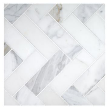 2" X 6" Herringbone mosaic in honed Calacatta marble.