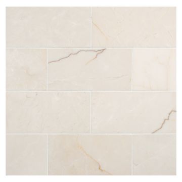 3" x 6" subway tile in honed Crema Soro marble.