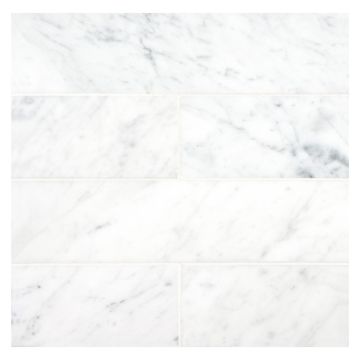 3" x 12" subway tile in honed Premium Carrara Claro marble.