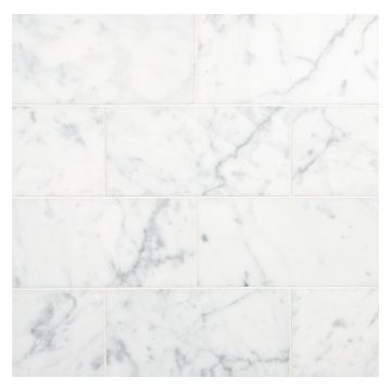 3" x 6" subway tile in polished Carrara marble.