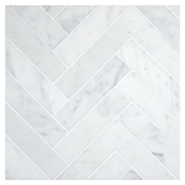 1-1/2" x 6" Herringbone mosaic in polished Carrara marble.