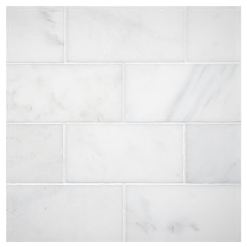 3" x 6" subway tile in polished White Blossom marble.