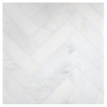 1-1/2 x 6 Inch Herringbone stone mosaic in White Blossom Ultra Premium honed marble. 