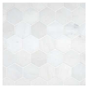 2-1/4" Hexagon mosaic in honed White Blossom marble.