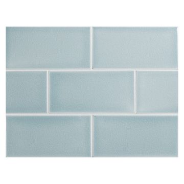 Vermeere 3" x 6" ceramic subway tile in Ice Blue with a crackle finish.
