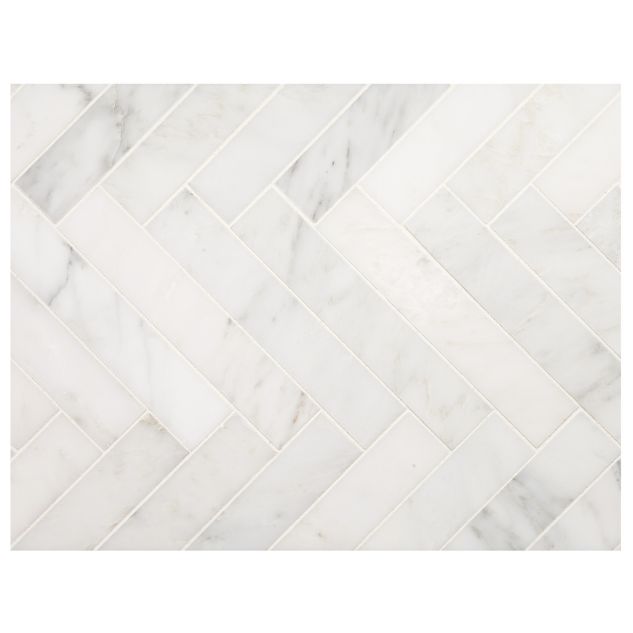 1-1/2" x 8" Herringbone mosaic tile in polished White Blossom marble.