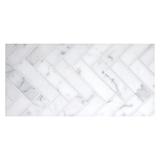 1" x 4" Herringbone mosaic in honed Calacatta marble.