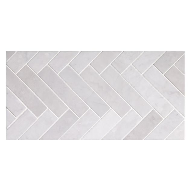 1" x 4" herringbone mosaic tile in polished Angel Breath Grey marble.