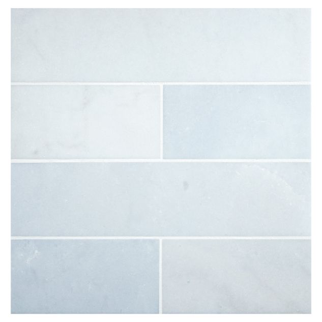 3" x 12" subway tile in honed Blue Caress Light marble.