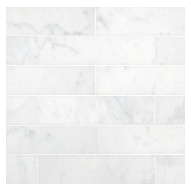 2" x 8" subway tile in honed Carrara marble.