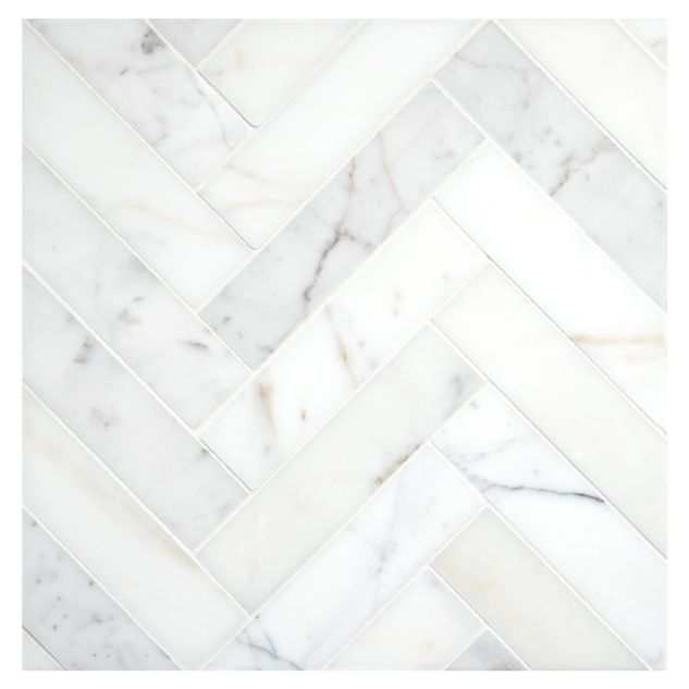 1-1/2" x 6" Herringbone mosaic in polished Calacatta Gold marble.