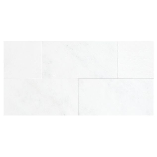 6" x 12" field tile in honed White Blossom marble. 