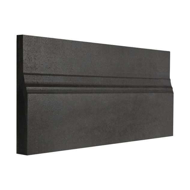 Angled view of 5 x 12 inch stone base molding in Deep Basalt with a honed finish.