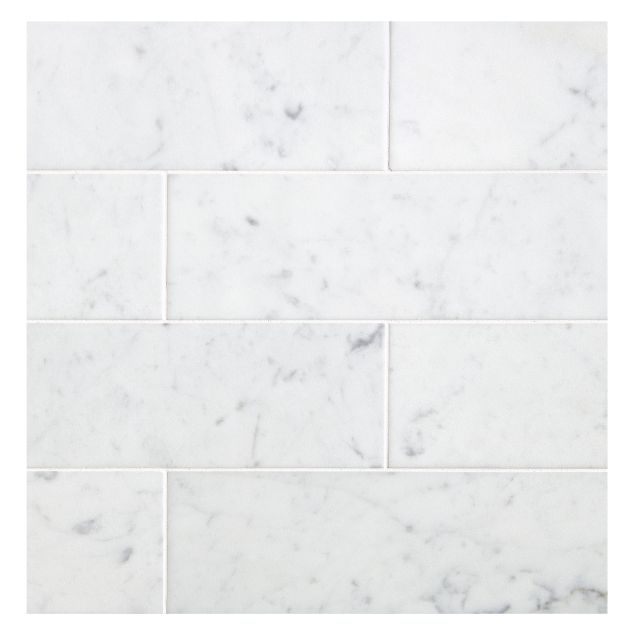 3" x 9" Subway tiles in Carrara Claro Light honed marble.
