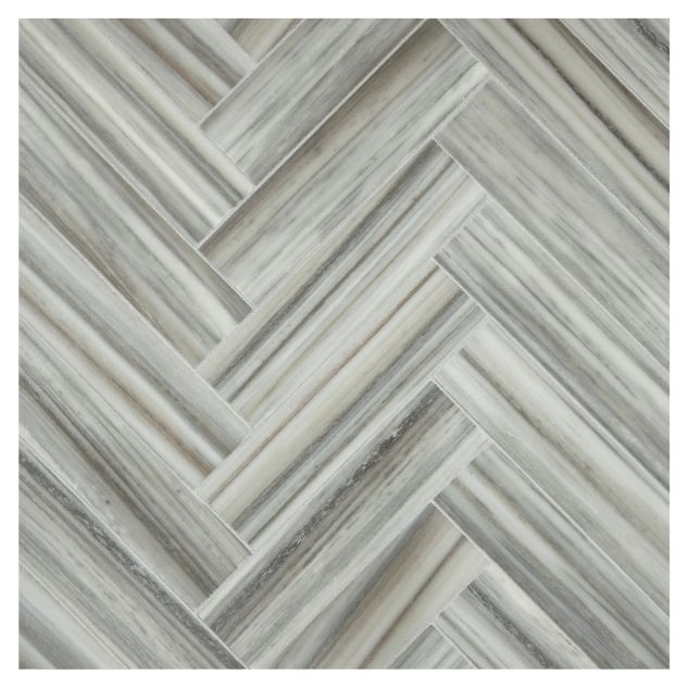 1-1/2" x 6" Herringbone mosaic in honed Striatini Gris marble.