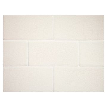 Vermeere 3" x 6" ceramic subway tile in Ice Cream with Taupe Vein Crackle finish.
