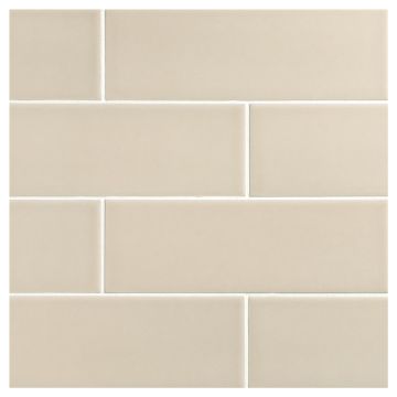 The Sazon Ceramic 3" x 9" subway tile in Greige with a Gloss finish.