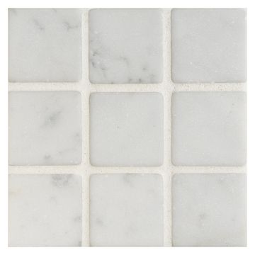 2" square mosaic in tumbled Bianco Carrara marble.