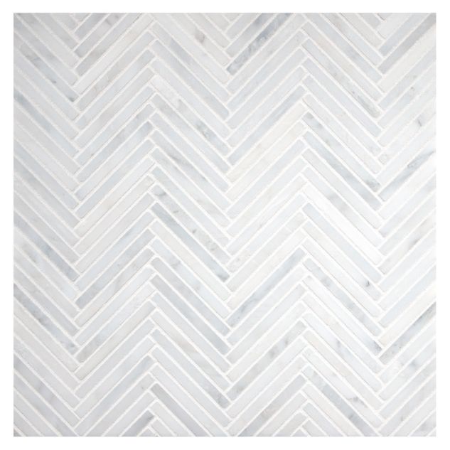 Herringstone mosaic tile in honed and polished White Blossom marble.