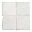 4" square tile in tumbled Bianco Carrara marble.