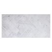 1" x 4" herringbone mosaic in honed Carrara marble.