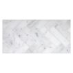 1" x 4" herringbone mosaic tile in honed Carrara Claro marble.