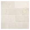 3" x 6" subway tile in polished Crema Marfil marble.