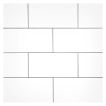 3" x 6" Ultra Flat ceramic Subway Tile in a glossy White color, seen with Black Grout. 
