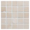 1" square mosaic tile in tumbled Crema Marfil marble.