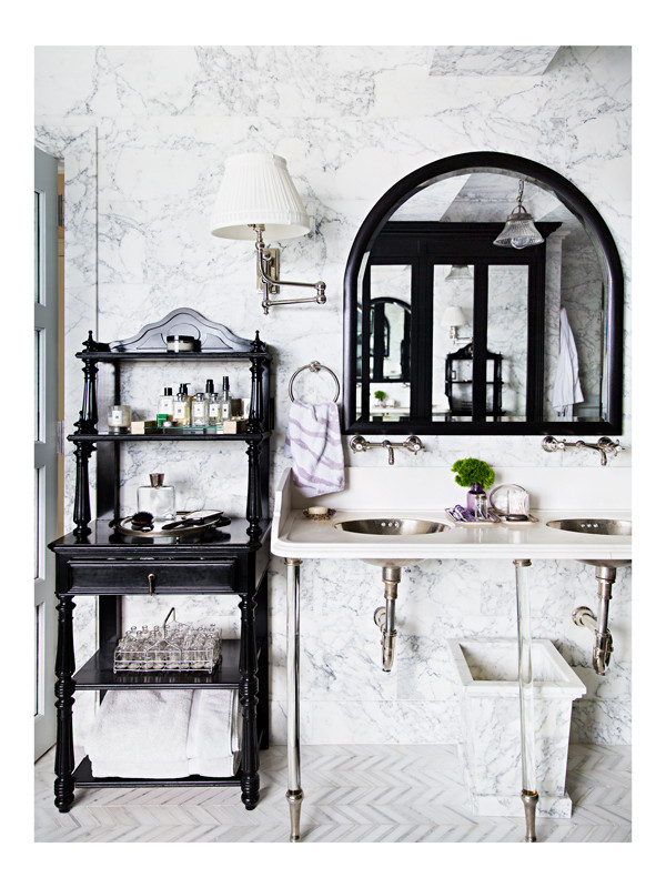 Celerie Kemble's master bathroom vanity detail, featuring an all marble clad wall and floor made from Arezzo marble.