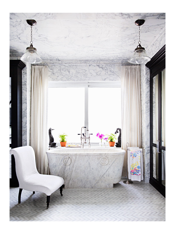Celerie Kemble's master bathroom design featuring a solid, oversized marble tub made from Arezzo marble.