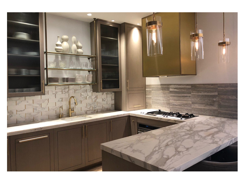 A luxurious kitchen design featuring the Love of Brass marble mosaic backsplash, made from Calacatta Gold and matte brass accents.