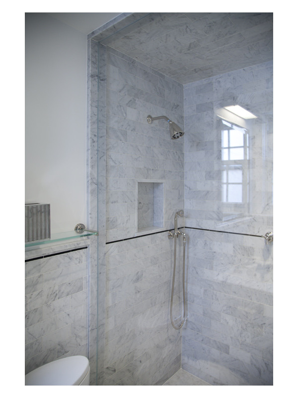 This marble clad bathroom design utilizes 3