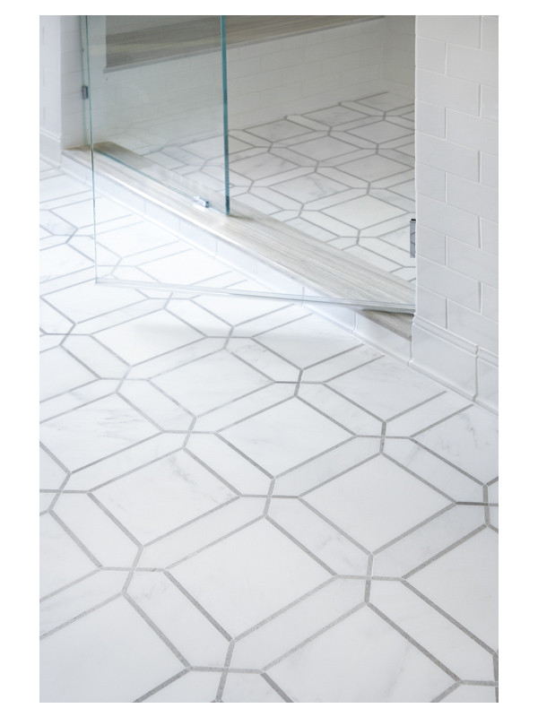 The Astor Square mosaic floor from the Complete Tile Collection is featured in this master bathroom design by Gary Cruz. It is made from honed White Blossom Ultra Premium and polished Cinderella Gray marble. 