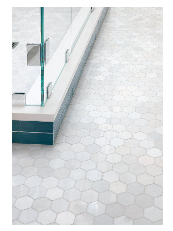 A close up of the Hexagon Honey mosaic floor made from Blue Caress Light polished marble.
