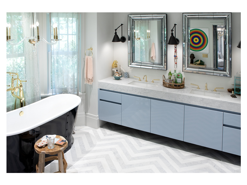 Apartment48's grand bathroom design, featuring the Art of Deco Chevron Solid tile in White Whisp Dolomiti and Carrara Claro Light honed marble, from the Complete Tile Collection.