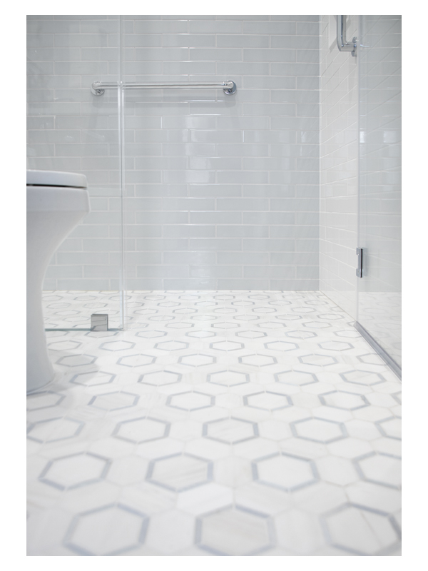 The Reflectagon mosaic by the Complete Tile Collection is featured in this bathroom design by Karen Blankenship. It is made from White Whisp Dolomiti and Blue Caress Light marble.